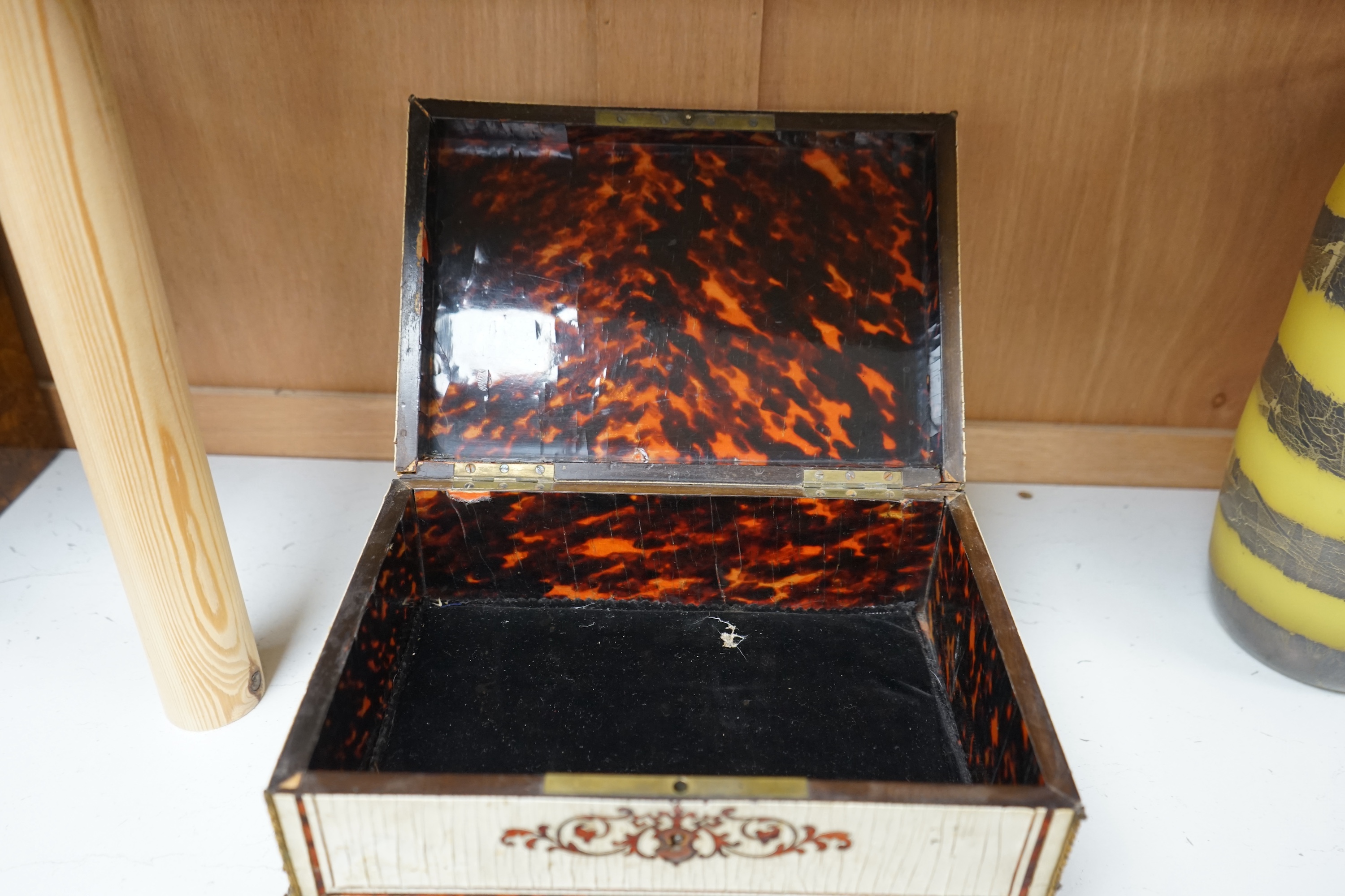 A 19th-century French tortoiseshell and faux lacquer work box, 24.5cm wide x 11.5cm high. Condition - poor to fair